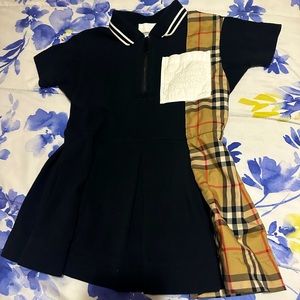 This polo dress from Burberry Kids is constructed from piqué and Vintage dress
